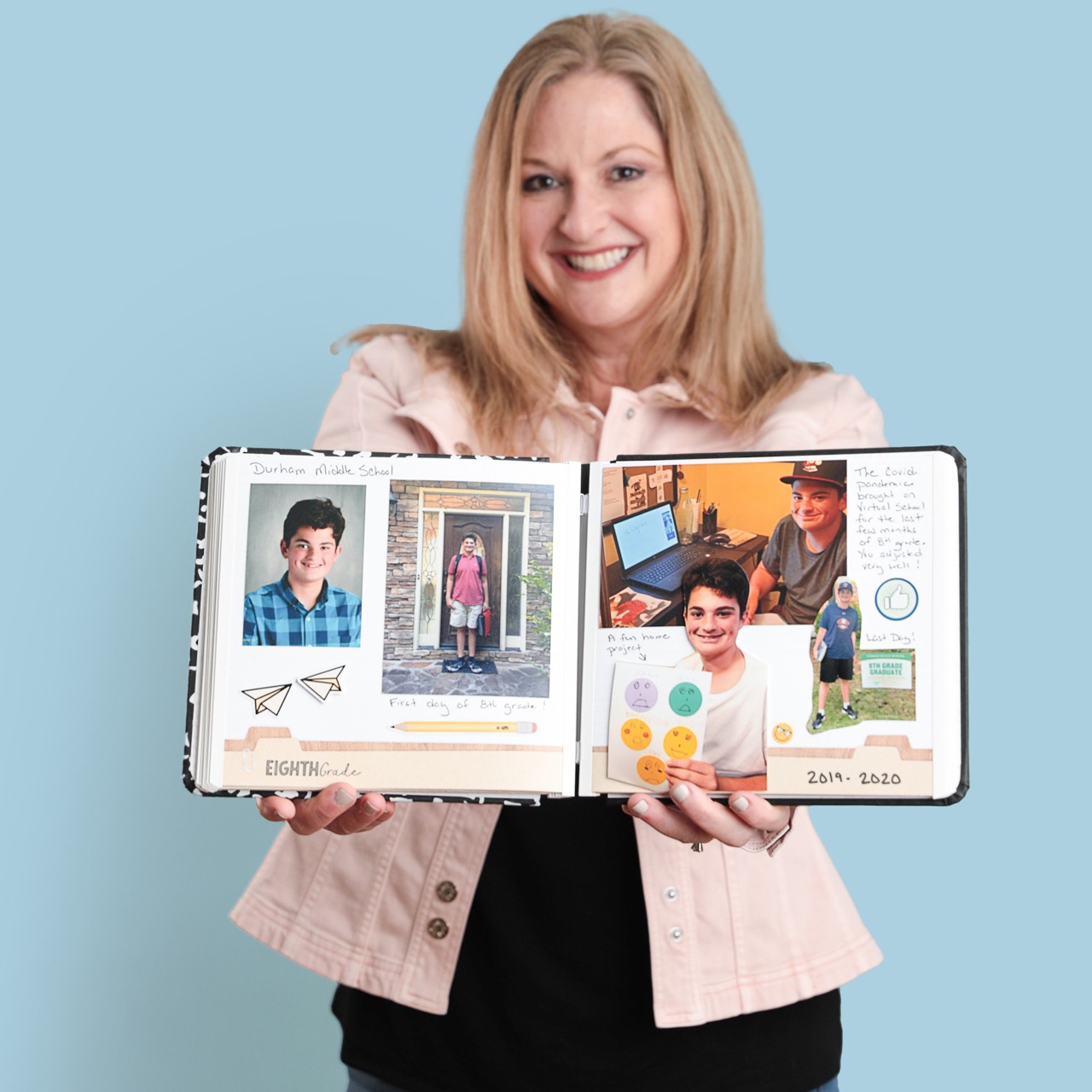 Woman Holding Scrapbook Open